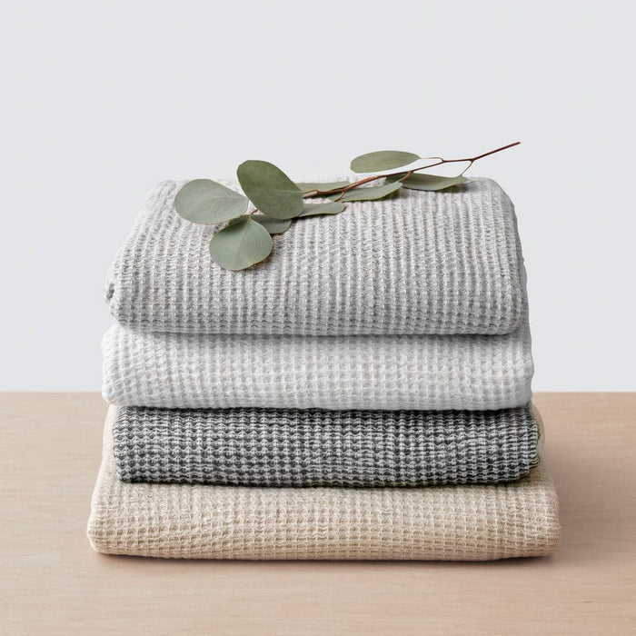 Stack of cotton waffle weave towels, black