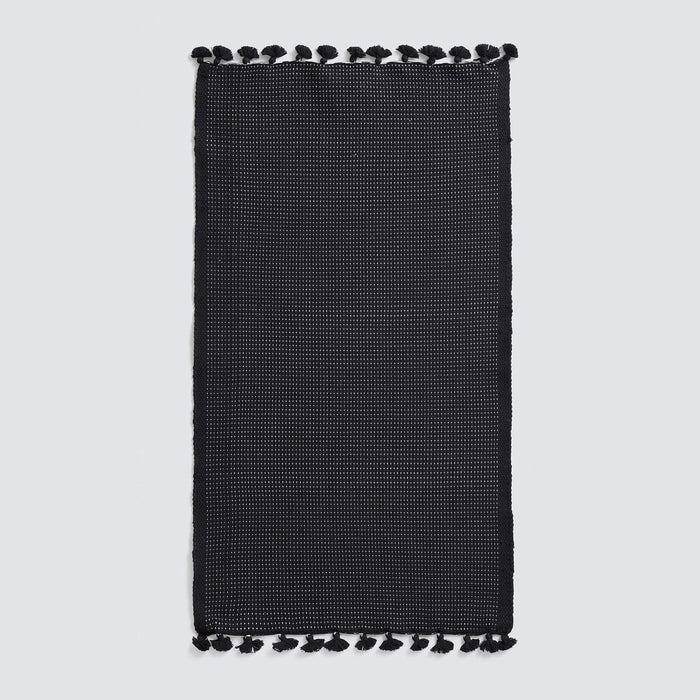 Black bath mat with tassels, black