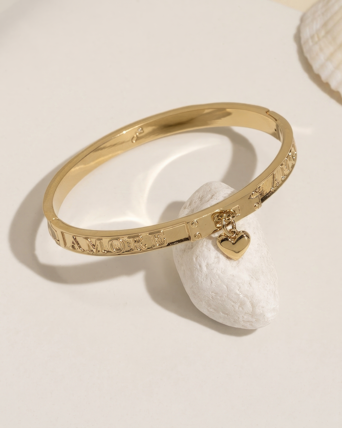 Gold bangle bracelet, flat lay