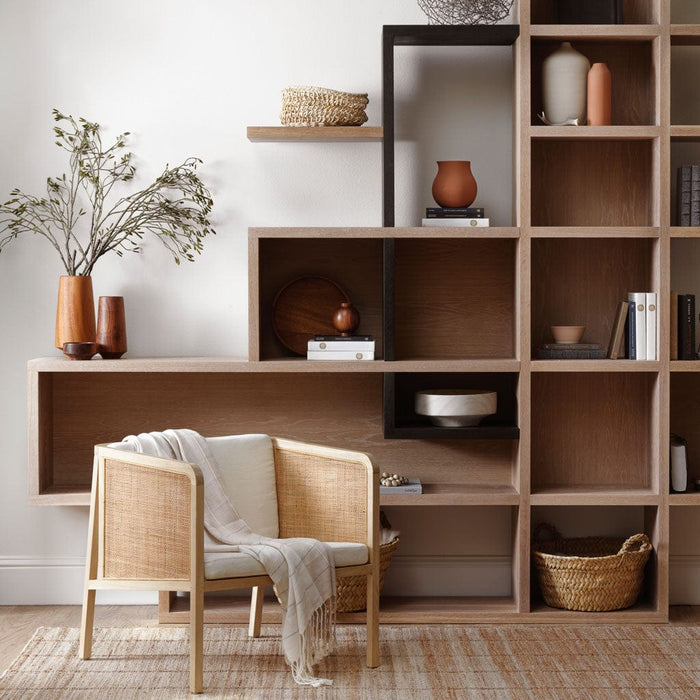 Neutral Grey Cream Tan Alpaca Throw Draped over Chair in Modern Home with Shelves