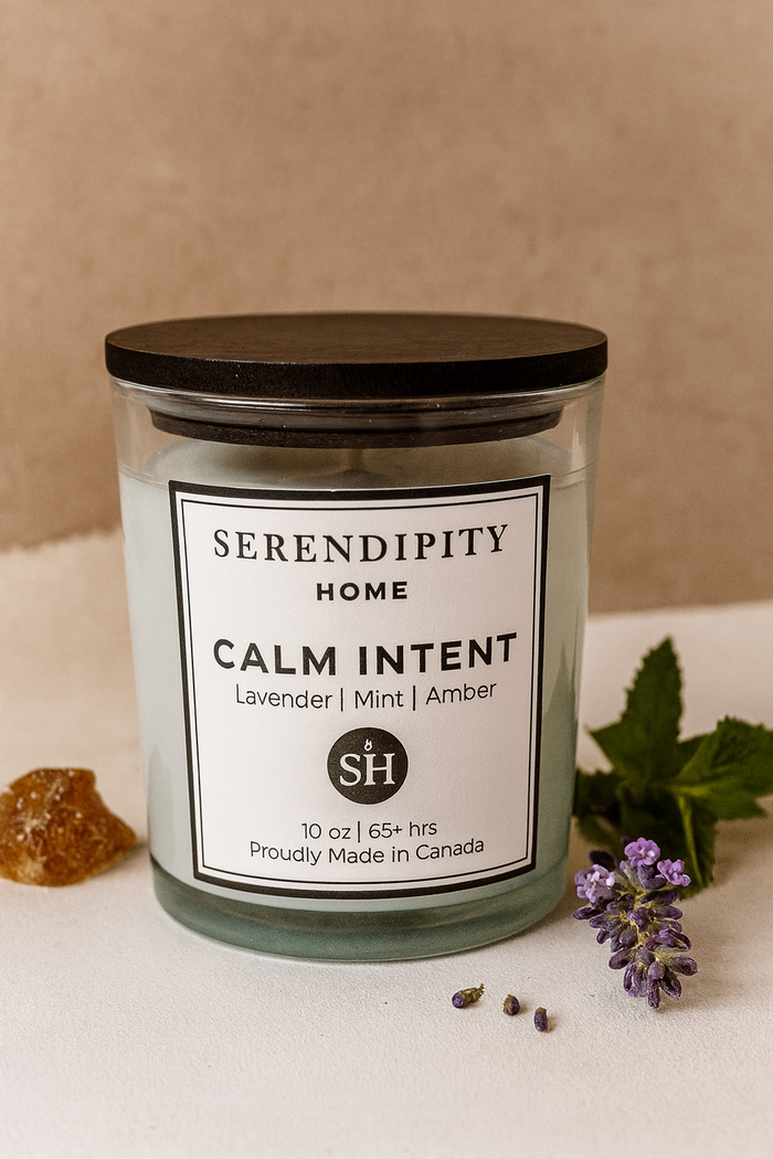 Serendipity Home Calm Intent candle with lavender and mint leaves on a beige background