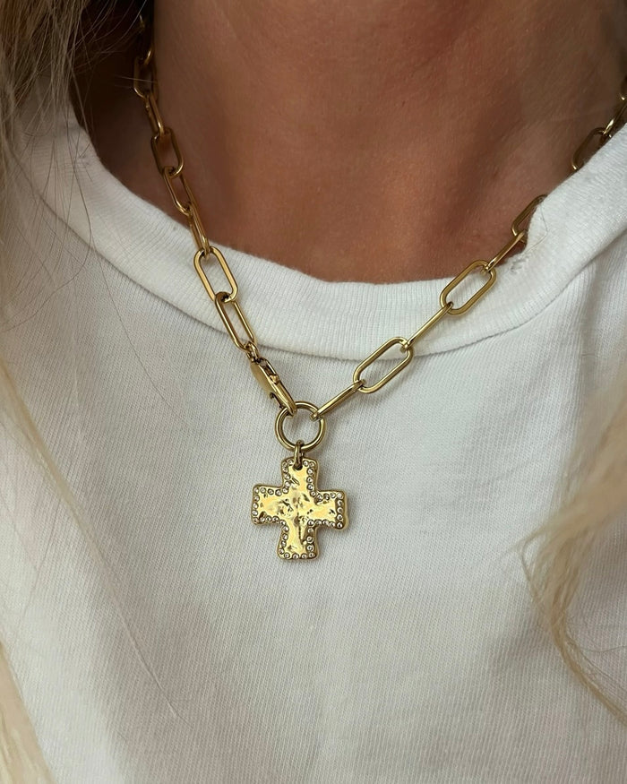 Gold necklace worn on a model
