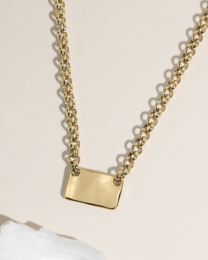 Gold chunky rolo chain necklace with rectangular polished ID plate pendant