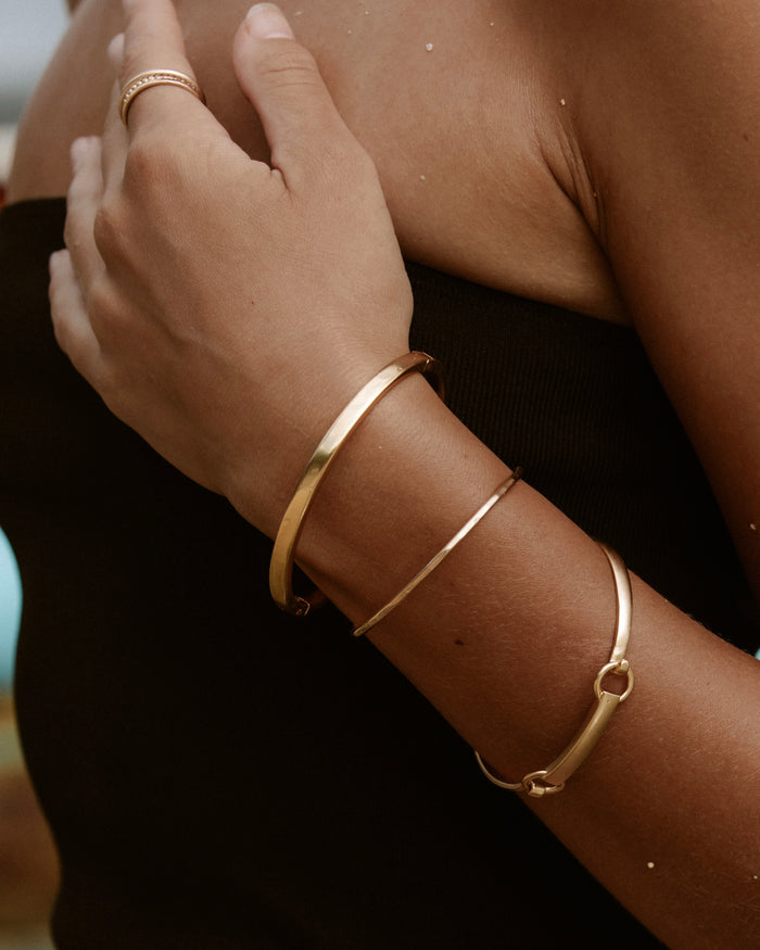 Classic gold bangle bracelet lifestyle product photo