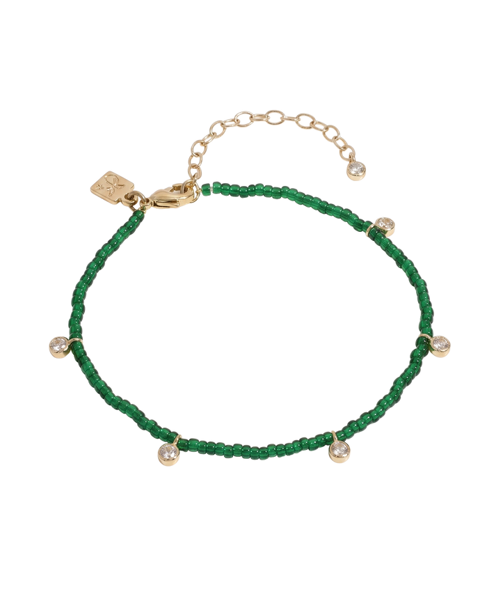 Beaded anklet with mixed crystal and gold bead accents on elastic cord