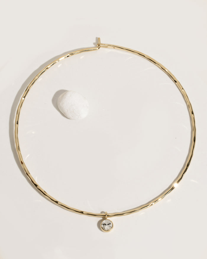 Gold rigid collar necklace with crystal accents