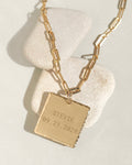 Custom square initial necklace with engraved letter in gold, product photo