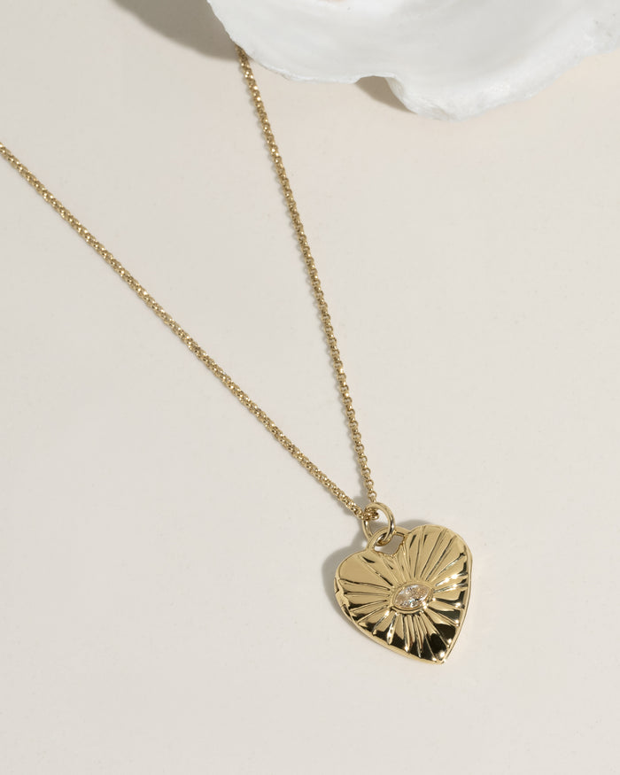 Gold necklace with a locket pendant