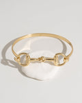 Gold bracelet with a horse-bit link design