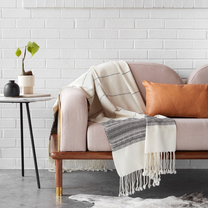 Black and White Throw Draped Over Couch, cream