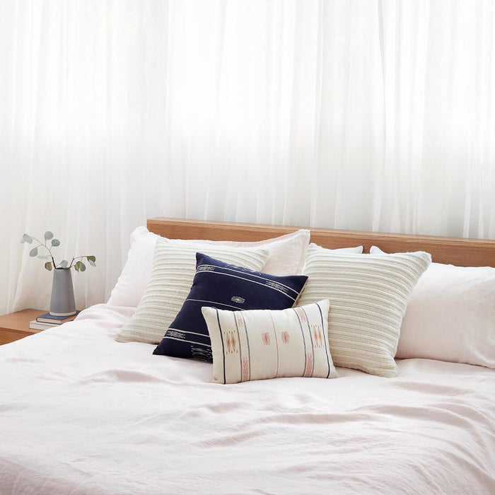 Cozy Bed with Styled Pillows