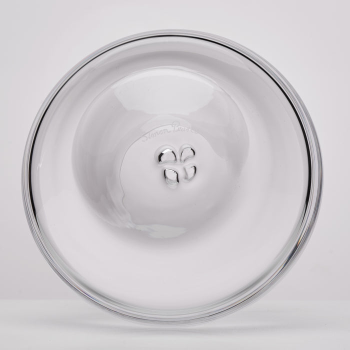 A clear glass bottom with a polished rim, photographed from directly above on a light gray background.