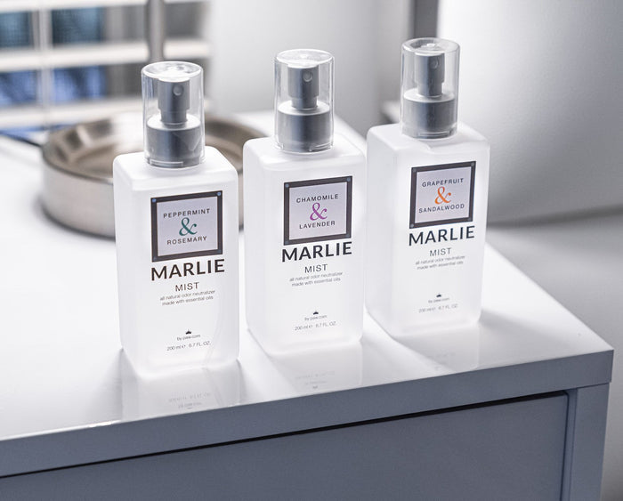 Luxury Bottles of Pet Odor Eliminator Mists on nightstand