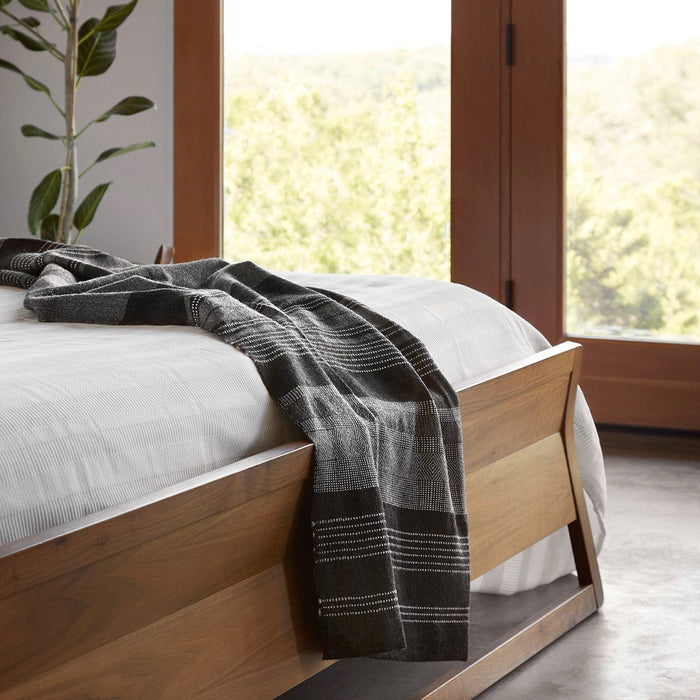 Alpaca Throw Blanket Draped Over Footboard, charcoal