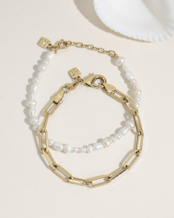 Set of two bracelets: freshwater pearl bead bracelet and gold paperclip chain bracelet with pearl accents