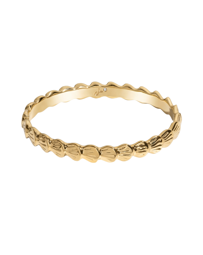 Gold beaded bracelet with tiny white shell charm pendant