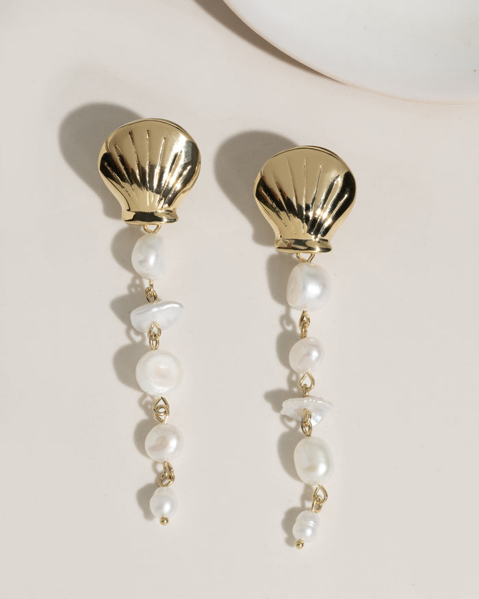 Long gold drop earrings with cascading freshwater pearl beads on hook wires