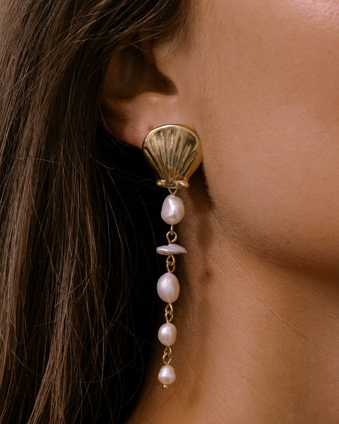 Long gold drop earrings with cascading freshwater pearl beads on hook wires