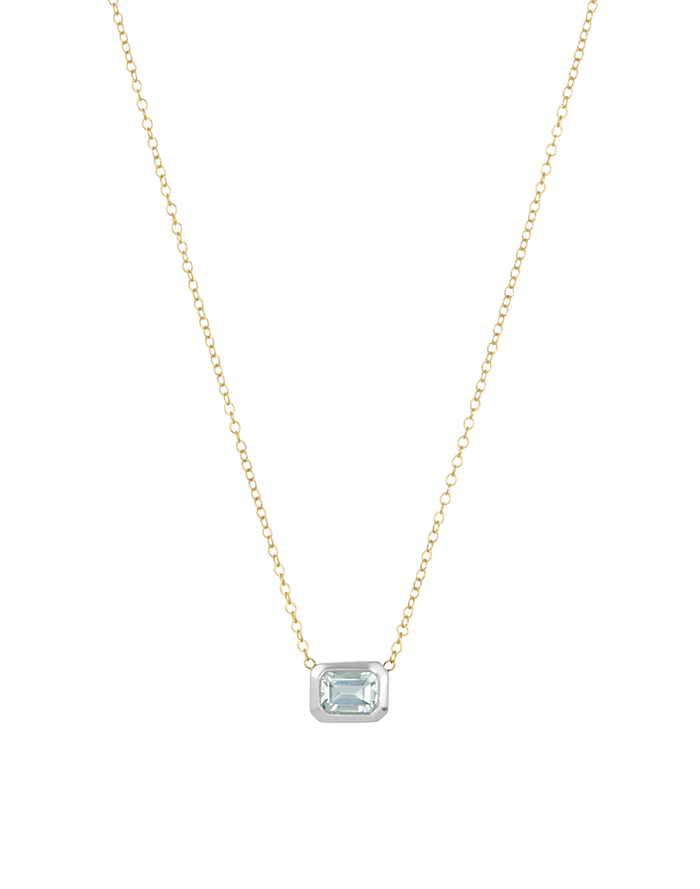 Delicate gold necklace with a small pendant