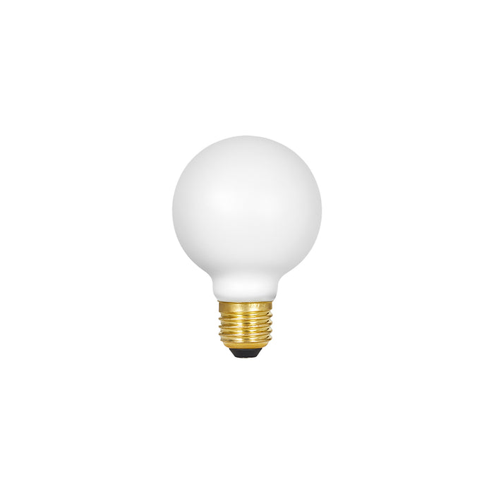 Spherical matte white LED bulb with brass threaded base and black contact point.