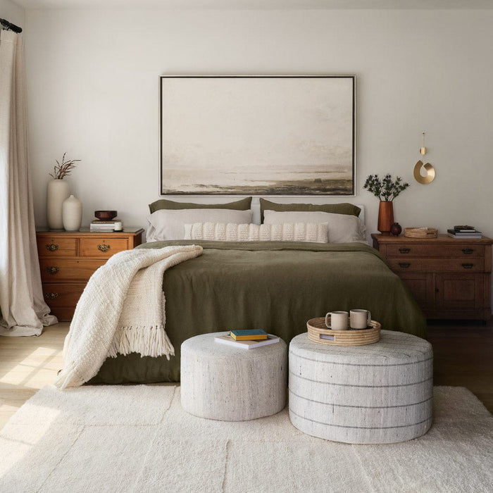 Textured lumbar on bed, ecru