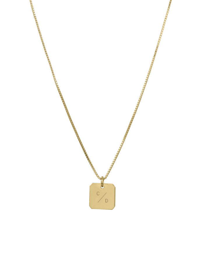 Gold square tablet necklace on curb chain with engraved initials