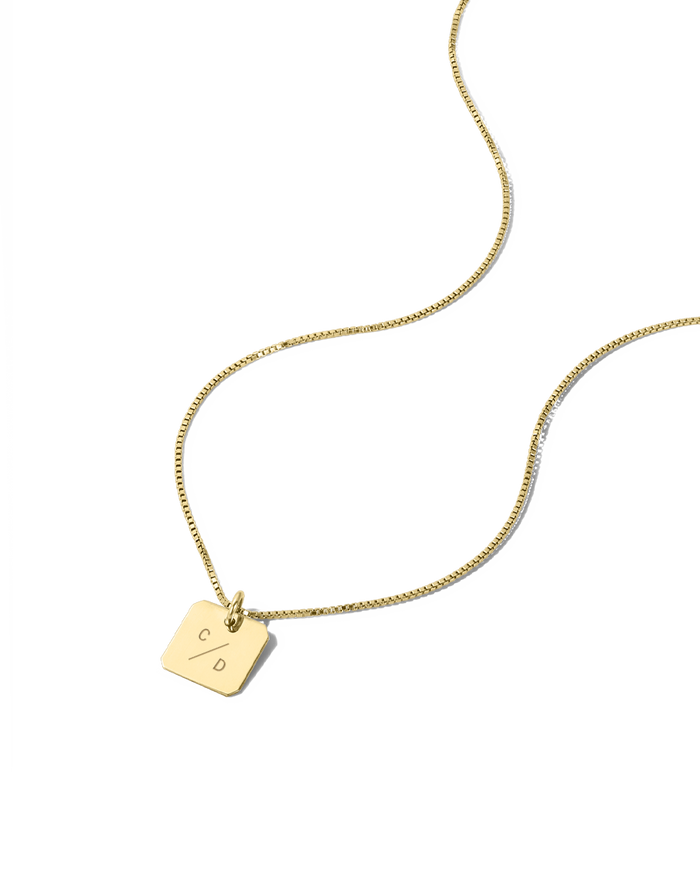 Gold square tablet necklace engraved with two initials