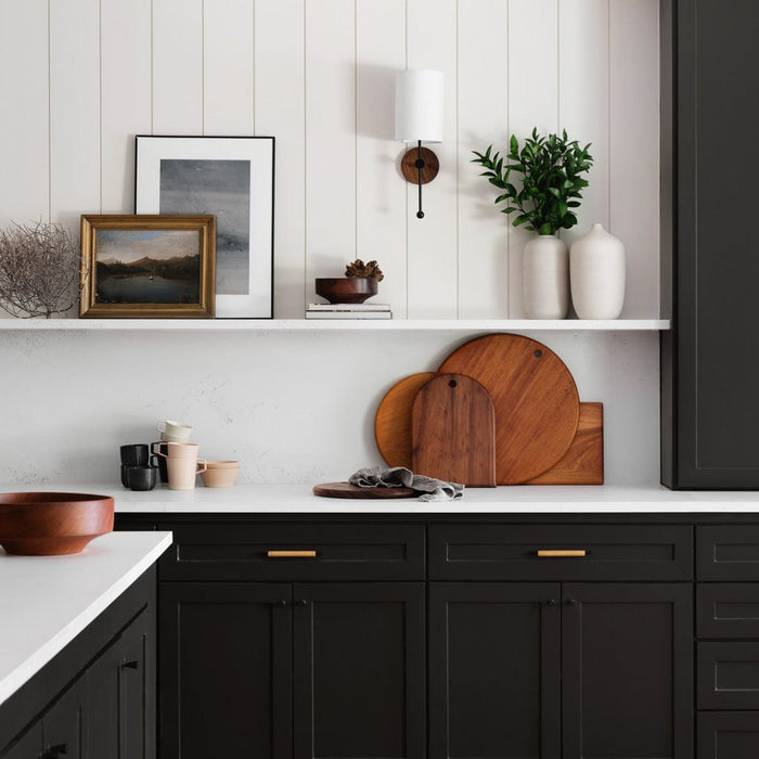 Wooden cutting boards in black and white farmhouse kitchen, mahogany