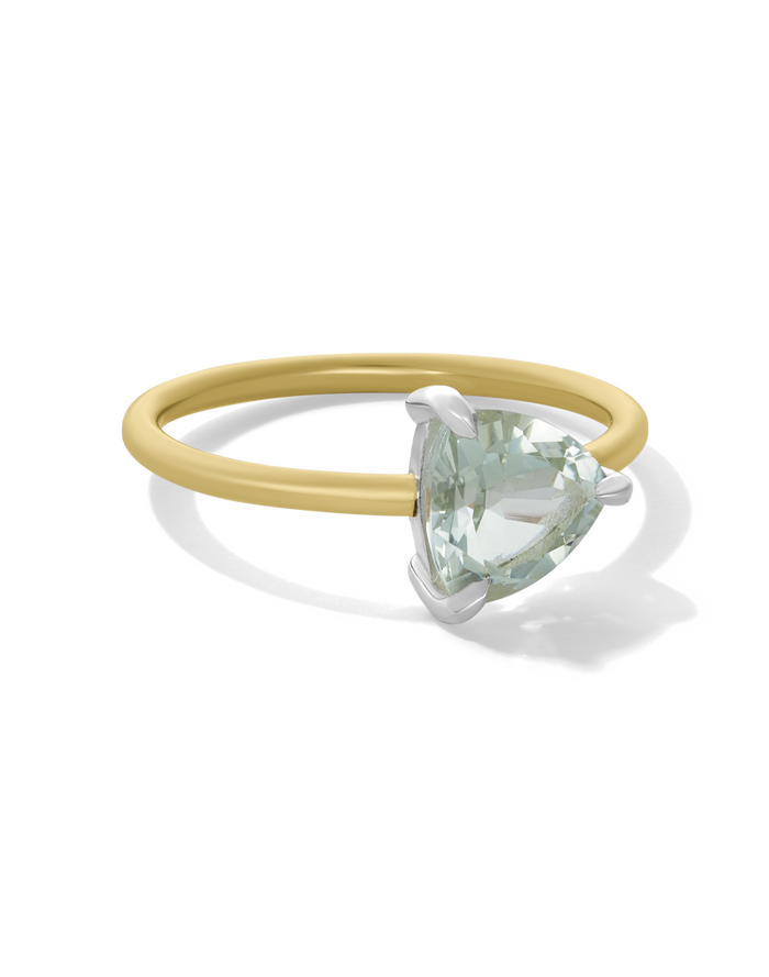 Gold talon-style ring with a trillion-cut gemstone