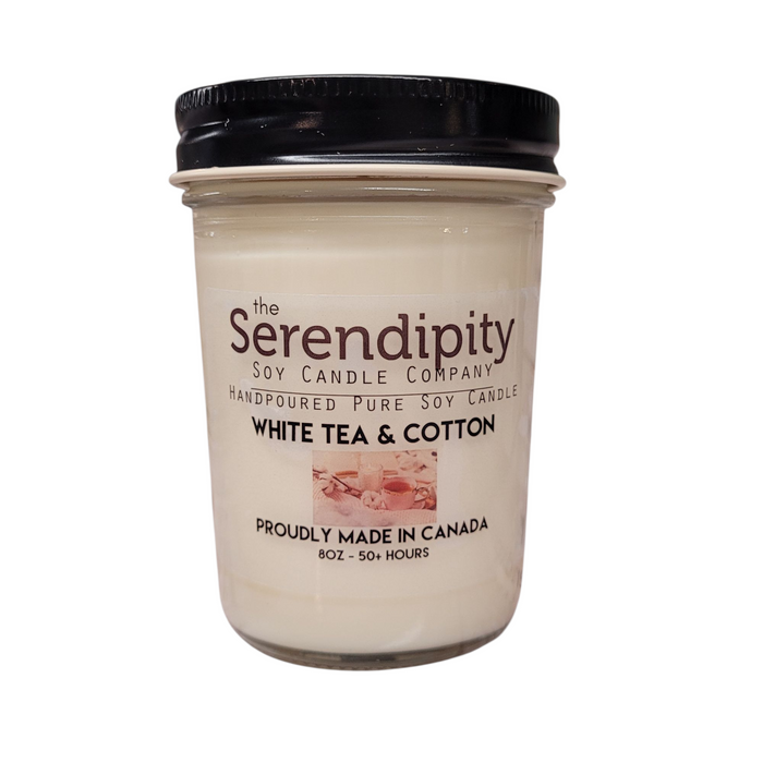 'Serendipity Soy Candle Company jar with 'White Tea & Cotton' label on a white background