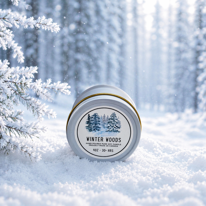 Candle jar labeled 'Winter Woods' in a snowy forest setting